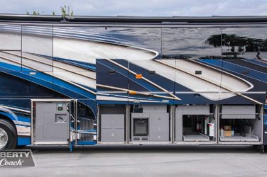 2023 Elegant Lady #894 exterior entry side undercarriage storage bays with pull out drawers of motorcoach