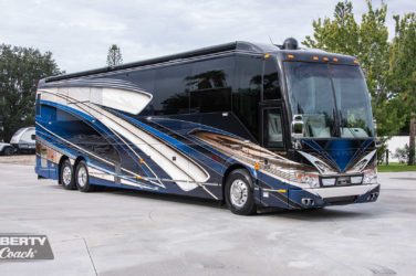 2023 Elegant Lady #894 exterior entry side front view of motorcoach on the lot