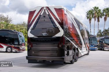2023 Elegant Lady 896 exterior entry side rear view of motorcoach on the lot
