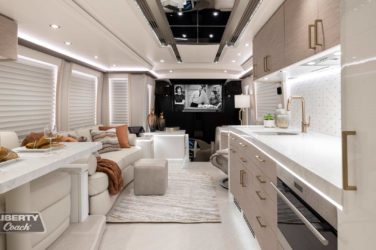 2023 Elegant Lady 896 motorcoach interior front look view of galley and dining area